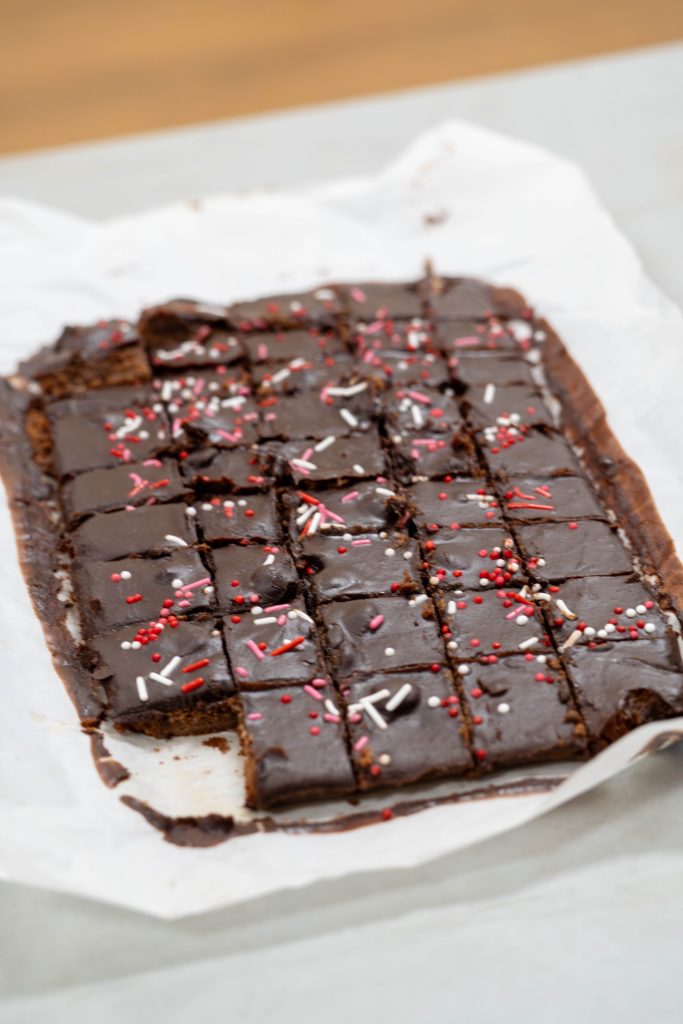 Chocolate brownies topped with colorful sprinkles, cut into squares